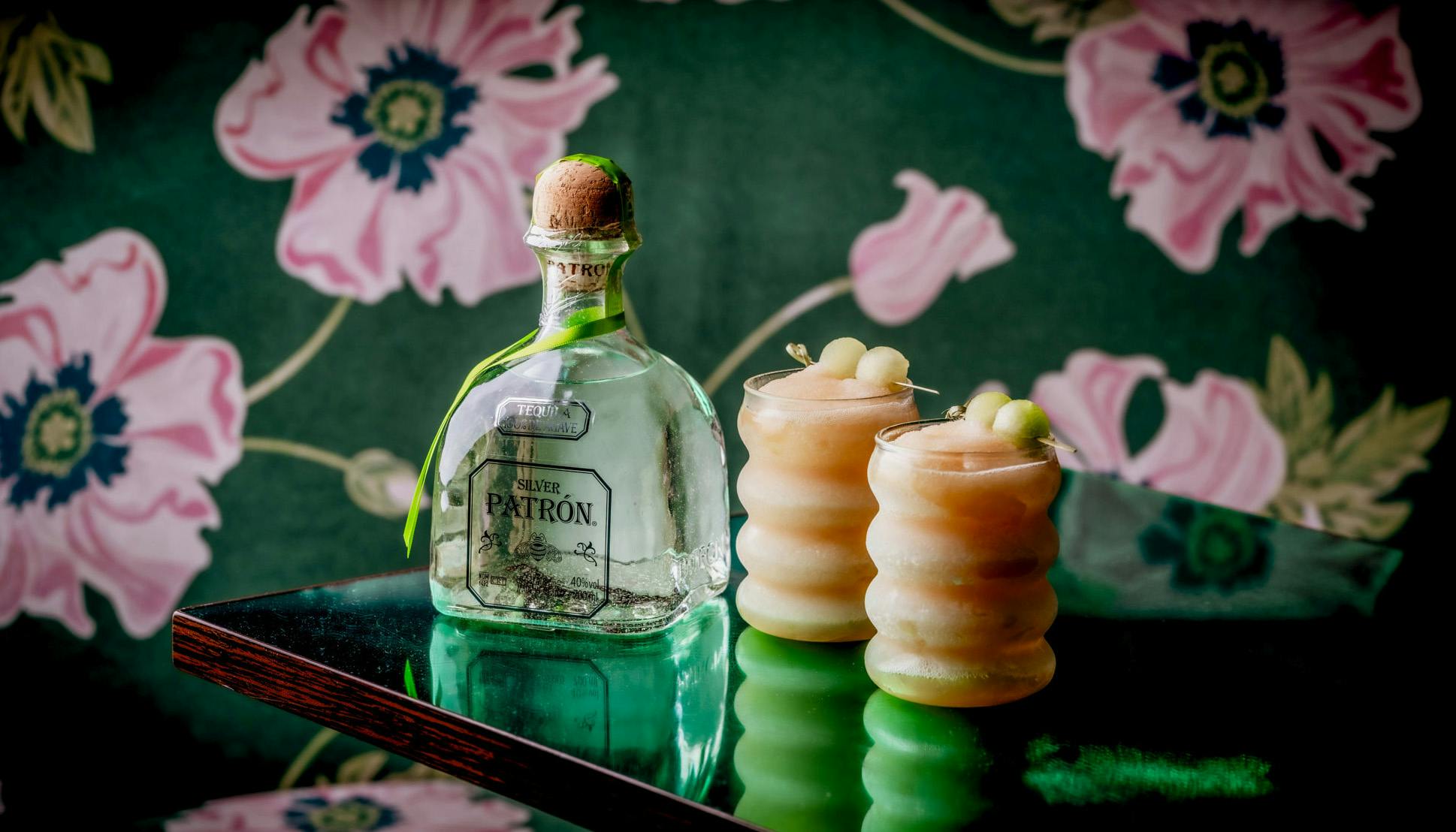 Two Paloma Cocktail and a Patron Tequila Bottle