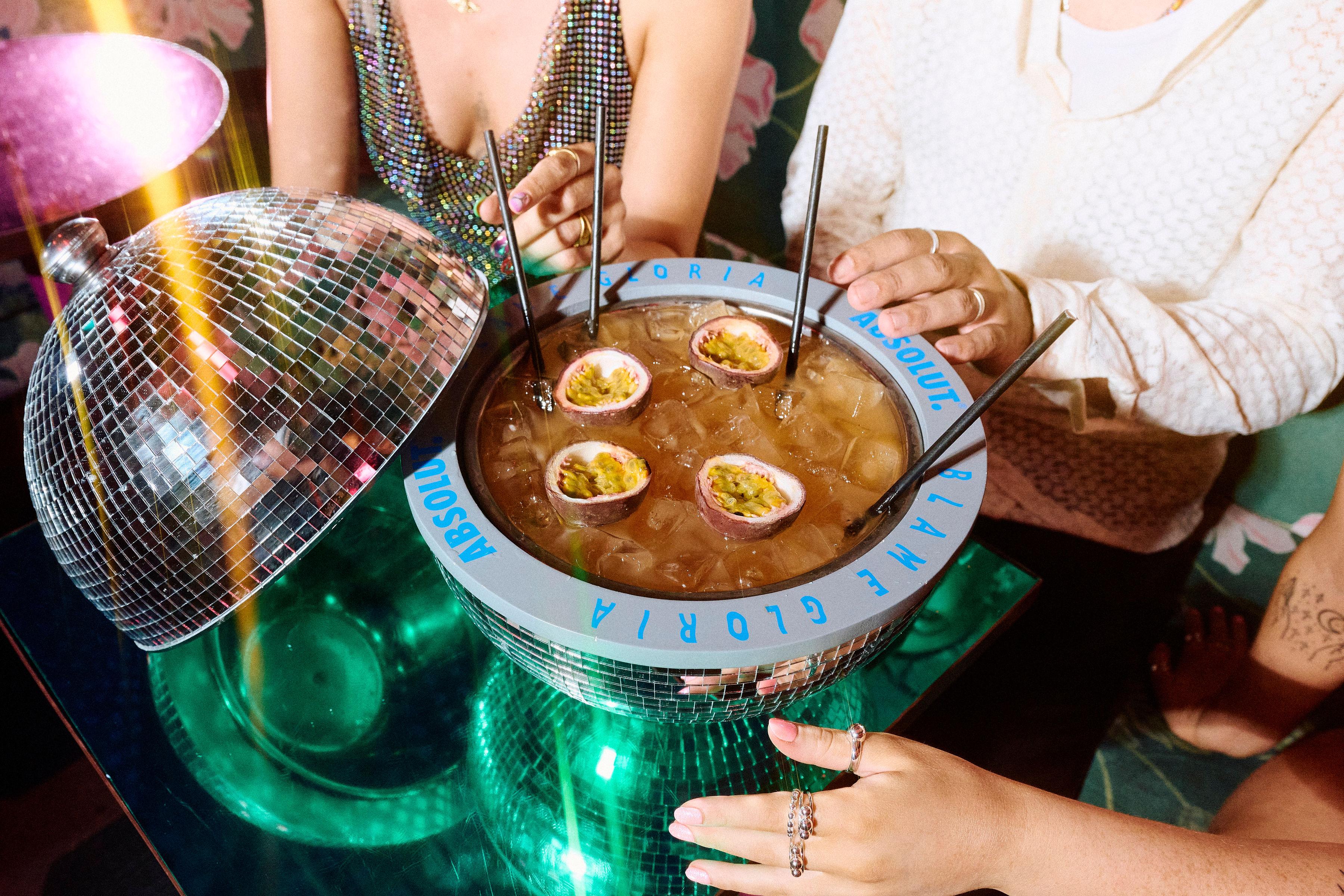 A sharer cocktail served in a disco ball